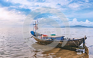 Fishing boat docking on the sand bars in morning sunrise