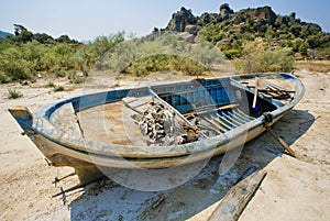 Fishing boat on the dry land near drying lake Bafa, rural Turkey.