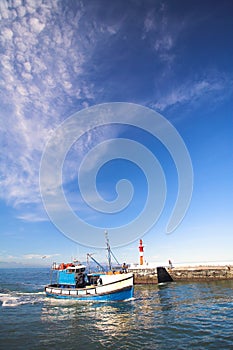 Fishing boat entering harbor