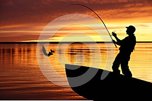 Fishing boat and fisherman with catching pike photo