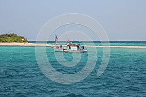 Fishing boat fishing in the open sea for a big fish