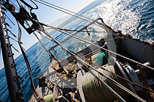 Fishing boat fishing by trawl in coastal waters