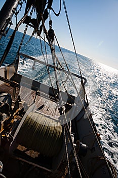 Fishing boat fishing by trawl in coastal waters