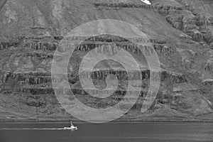 Fishing boat and fjord in Iceland.