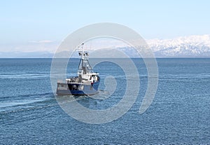 Fishing boat going out to sea