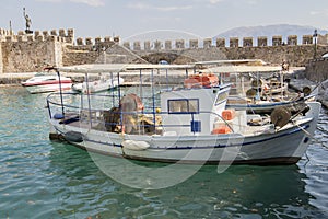 Fishing Boat in Harbor mountain background