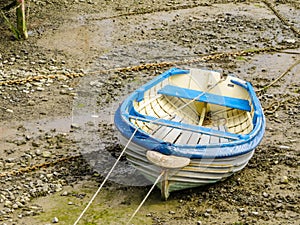Fishing boat in a harbour during outflow