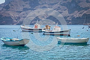 fishing boat harbour in santorini photo