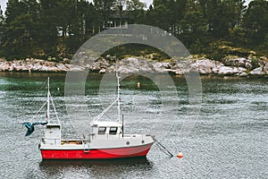 Fishing boat and house in forest island sea Landscape in Norway scandinavian