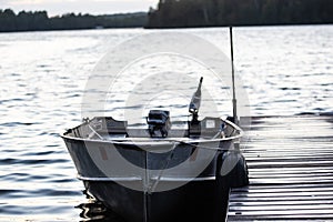 Fishing boat hull tied to a dock at day end after fishing.