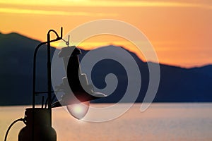 Fishing boat lamp on an old fishing boat with the sunset