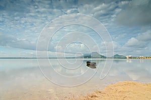 Fishing boat in large reservoir with nice sky and cloud