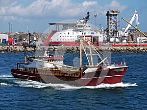 Fishing Boat Leaving Port to Sea.