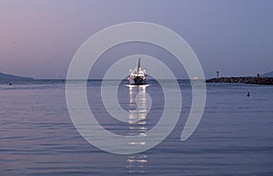 Fishing boat leaving Ventura harbor dawn