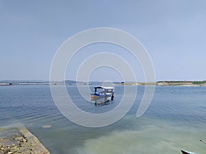 fishing boat in the middle of the lake