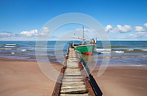 Fishing boat at a mole.