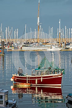 Fishing Boat moored in a calm Brixham Harbour