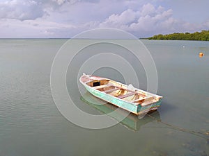 Fishing boat moored in caribbean sea.