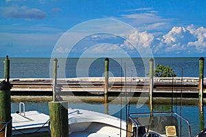 Fishing boat moored on dock in bay in Marathon Key