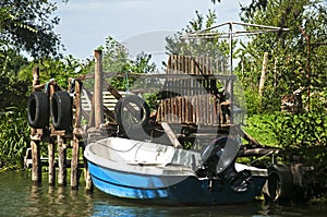 Fishing boat moored to fishing hut