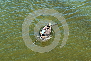 Fishing boat at the mouth of the Thu Bon river in Hoi An, Vietnam