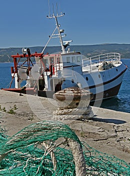 Fishing boat and net in harbor