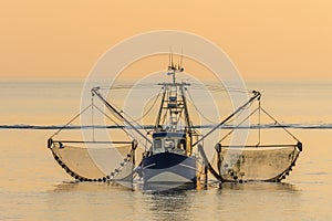 Fishing Boat with Nets at Wadden Sea in Evening Light, North Sea, Germany