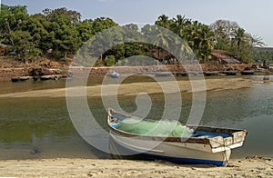 Parked fishing boat on the water age of Nivati India photo