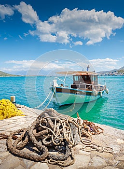 Fishing Boat off the coast of Crete with marine rope and fishing