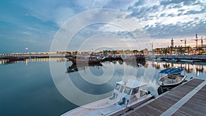 Fishing boat parked near the fish market next to Kuwait City Area day to night timelapse