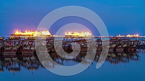 Fishing boat parked near the fish market next to Kuwait City Area day to night timelapse