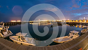 Fishing boat parked near the fish market next to Kuwait City Area day to night timelapse