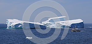 Fishing Boat Passing Big Iceberg