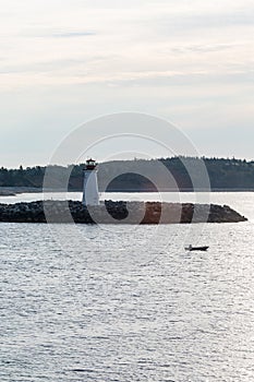 Fishing Boat Past Lighthouse in Dawn Light