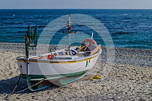 Fishing boat pulled ashore on the beach