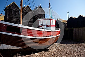 Fishing boat red ship moored in Hastings uk