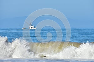 Fishing boat returning to the harbor.