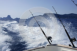 Fishing boat with rod and reels in mediterranean