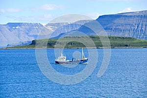 Fishing boat sailing in the calm Atlantic Ocean