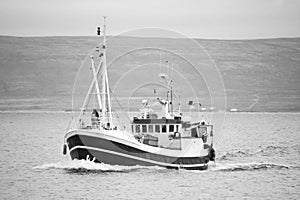 Fishing boat while sailing in the ocean