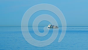 Fishing Boat Sails For Fishing. Fishing Boat In The Middle Of The Sea. Still.