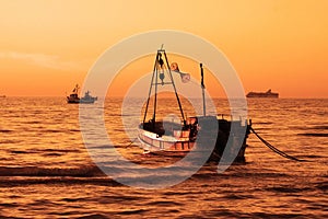 Fishing boat at sea.