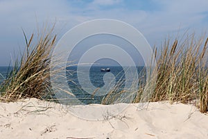 fishing boat by the sea beach, DziwnÃ³w, Poland