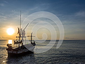 The fishing boat on the sea in the morning.