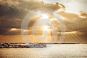 Fishing boat on the sea water and sunray is background.