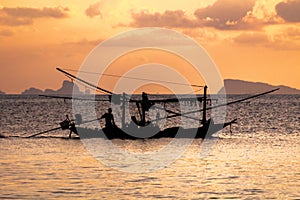 Fishing boat silouhette at sunset