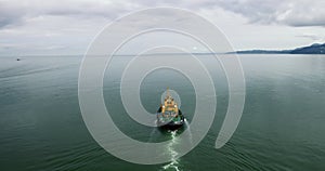 Fishing boat. A small ship floats on the surface of the sea.