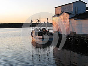 Fishing boat at sunset