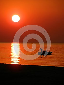 Fishing boat at sunset