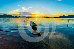 Fishing boat with sunset at Bang phra reservoir ,sriracha chon buri,  thailand